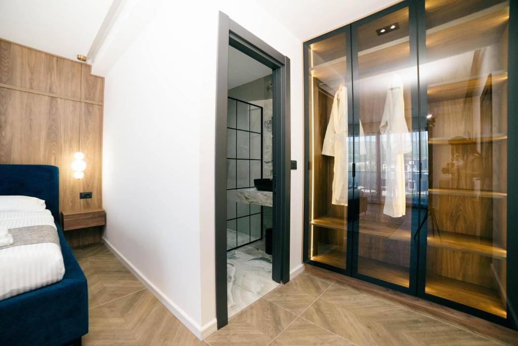 Modern room interior with wooden wardrobe at Boutique Hotel Zara