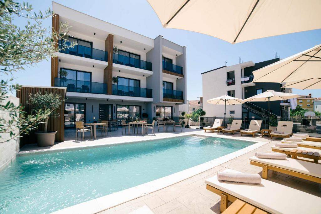 Outdoor swimming pool and terrace at Boutique Hotel Zara in Ulcinj
