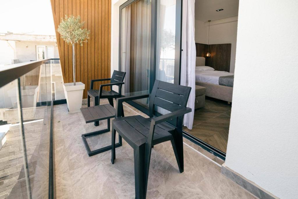 Private balcony with pool view at Boutique Hotel Zara
